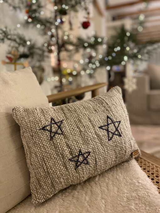woven cushion with stars