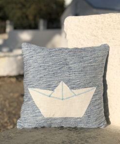 Handwoven cushion with white boat